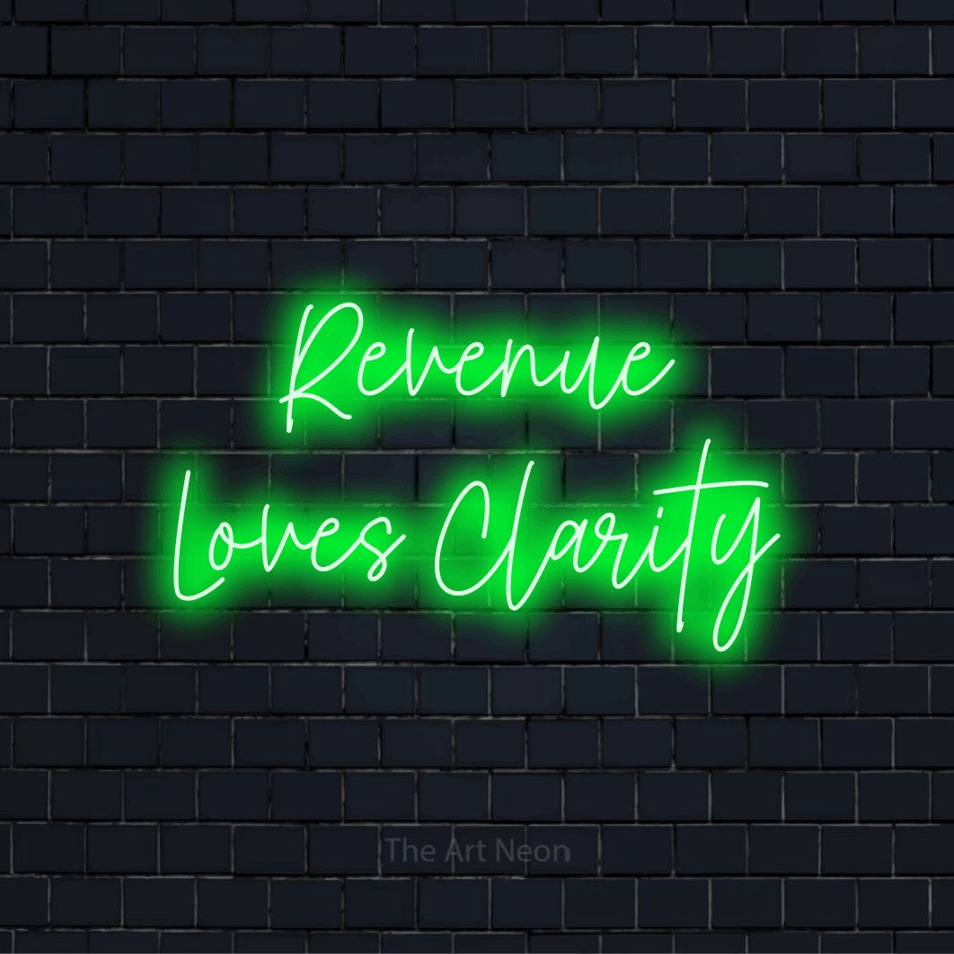 "Revenue Loves Clarity" LED neon sign on a black brick wall