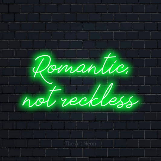 "Romantic, Not Reckless" text design with neon effect on a black brick wall