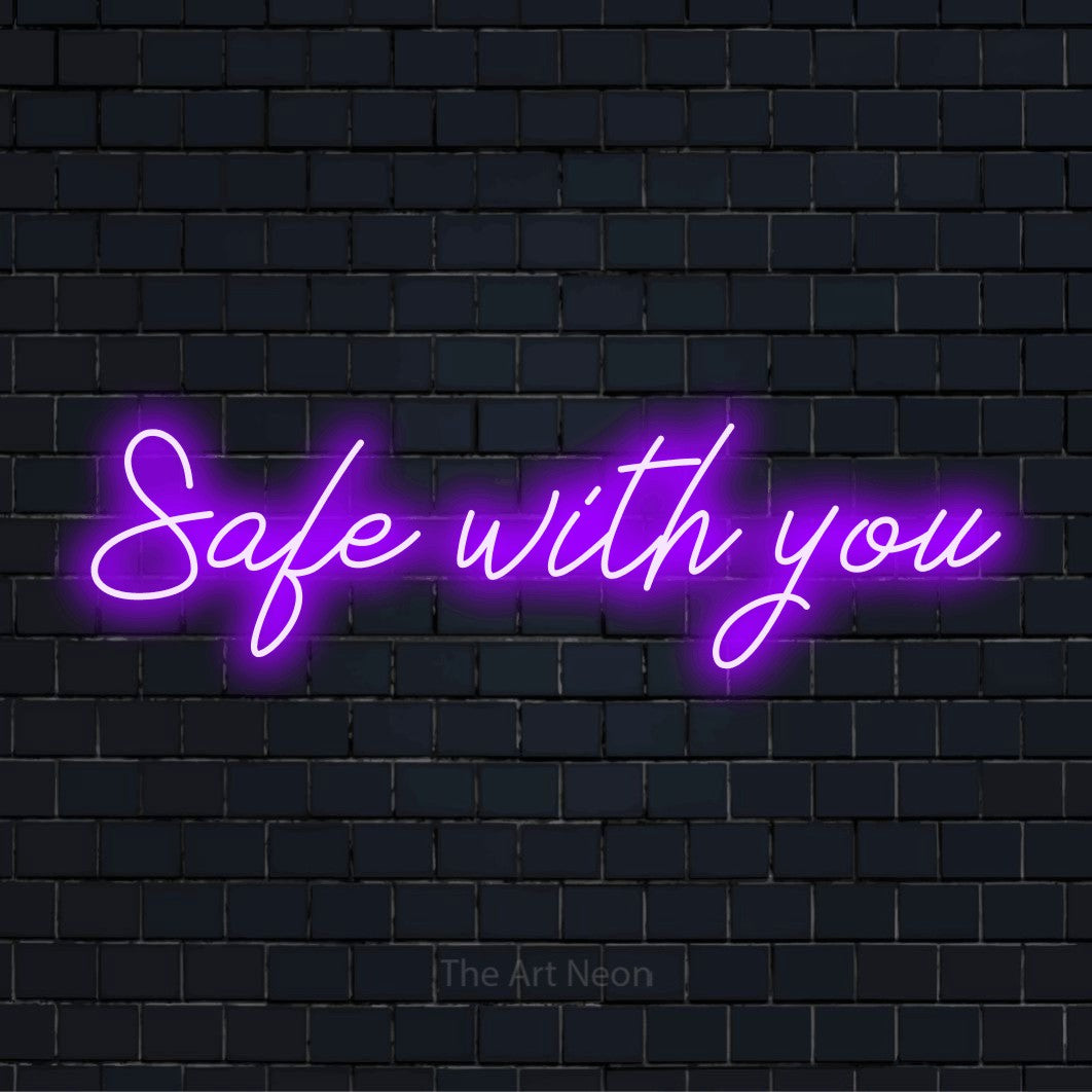 "Safe With You" neon text design on a black brick wall