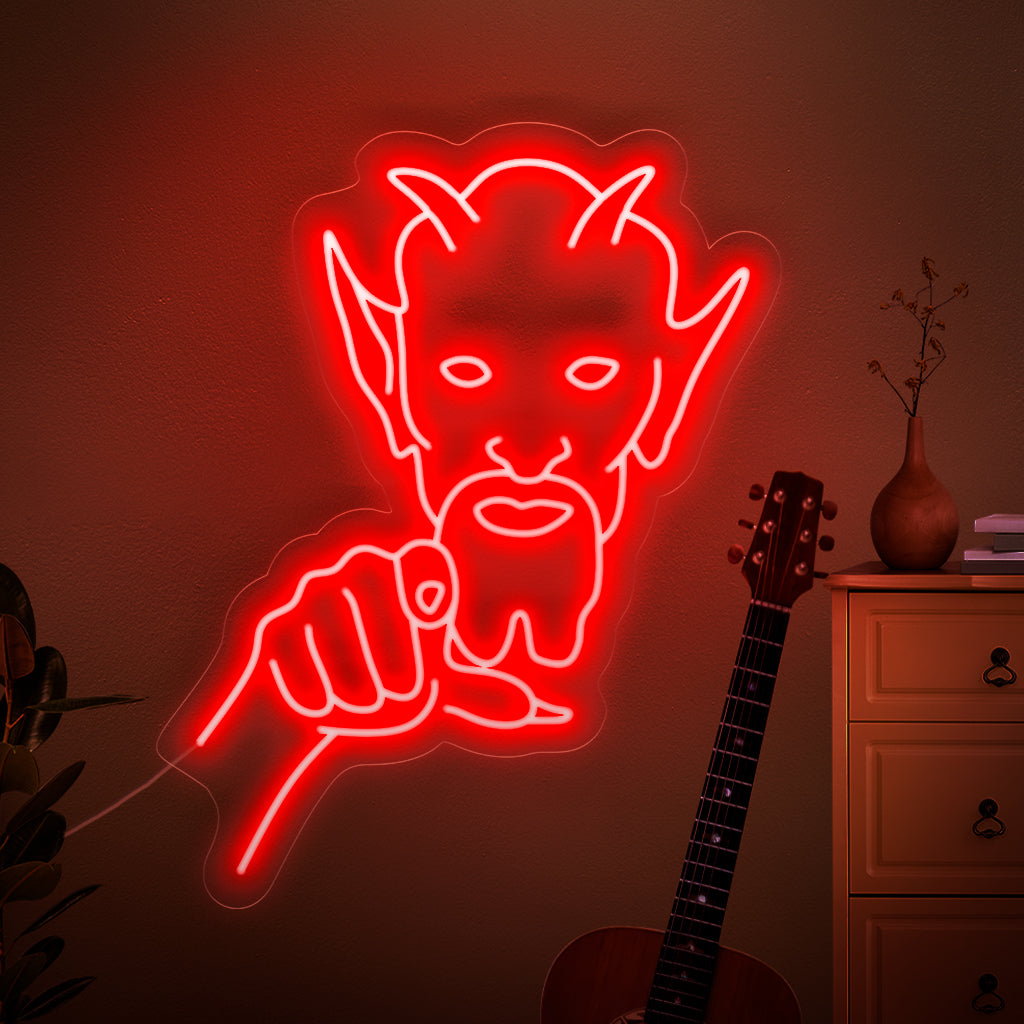 A haunting neon sign featuring a menacing demon pointing directly at you, creating a sense of fear and unease.