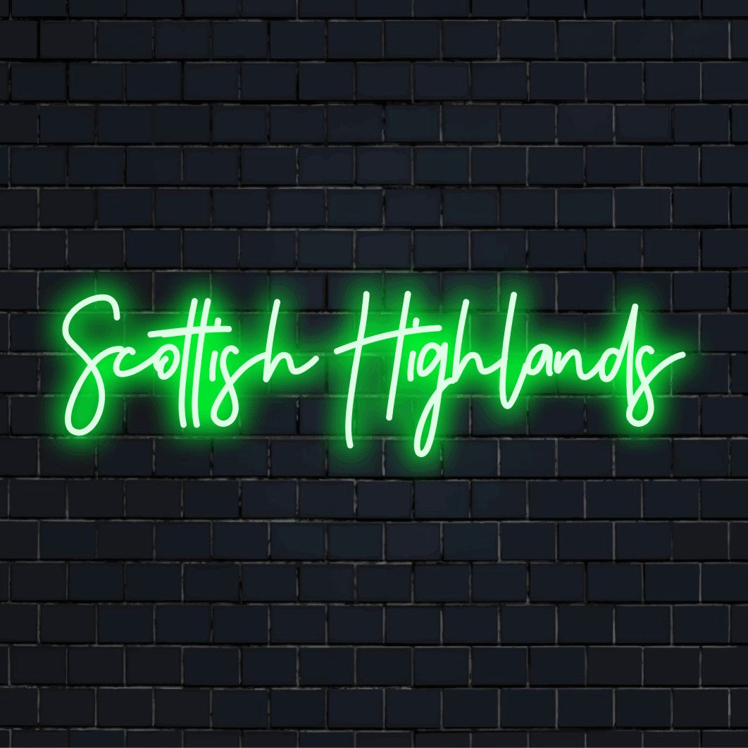 Scottish Highlands Neon Light with bright neon lettering against brick backdrop
