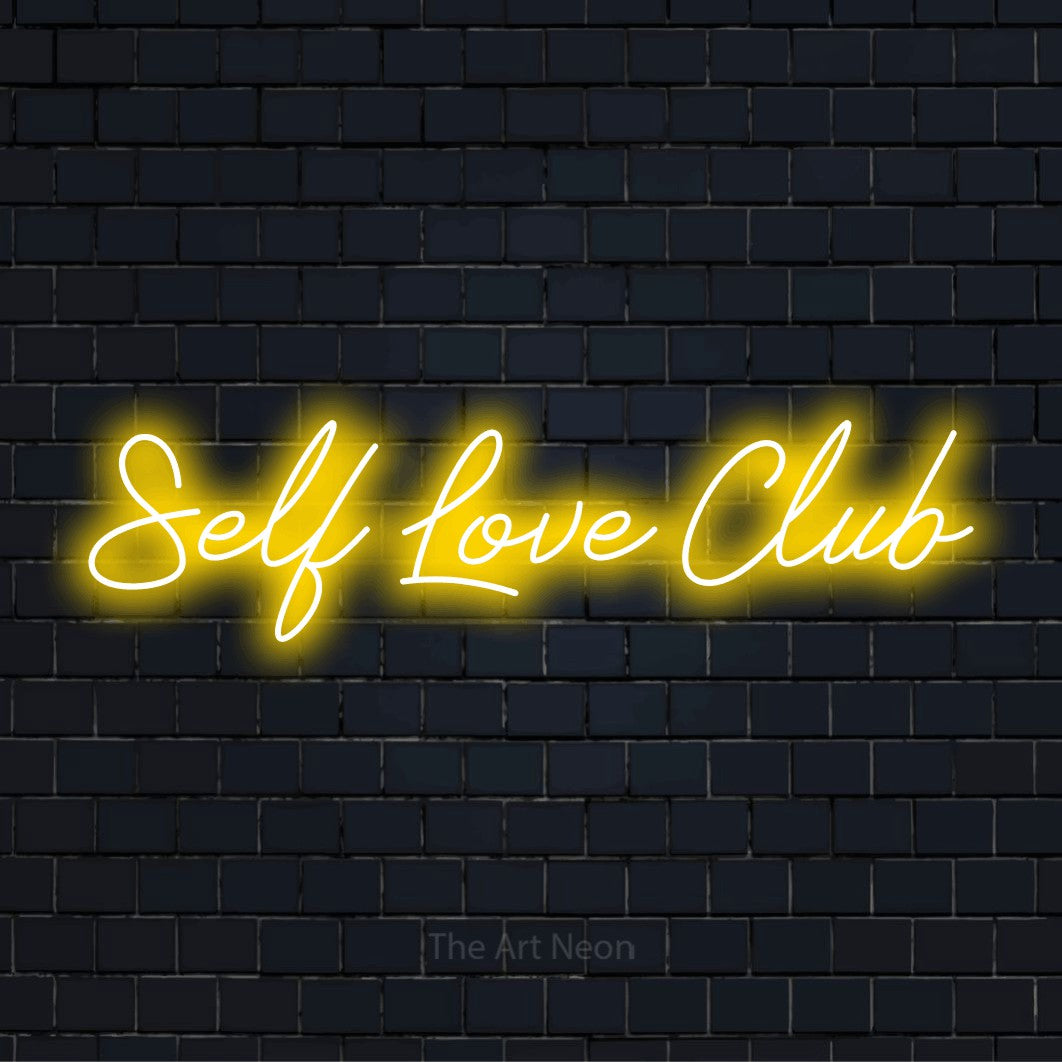 "Self Love Club" LED neon sign on a black brick wall