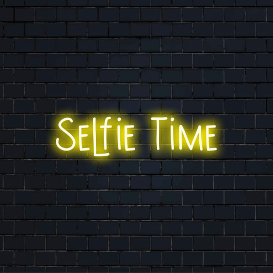 Selfie Time LED Neon Sign, glowing neon text on dark brick wall
