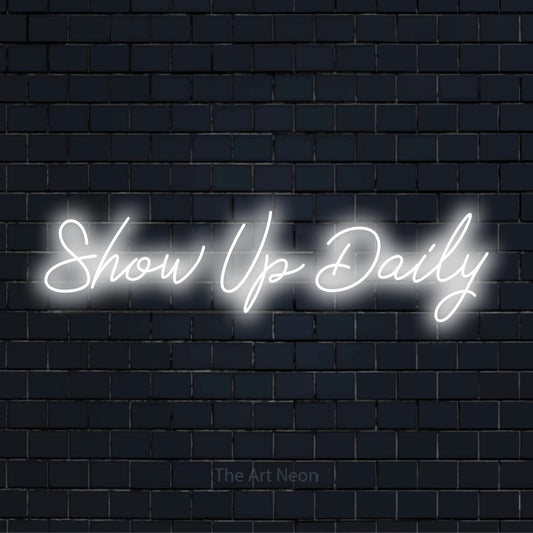 "Show Up Daily" text design with neon effect on a black brick wall