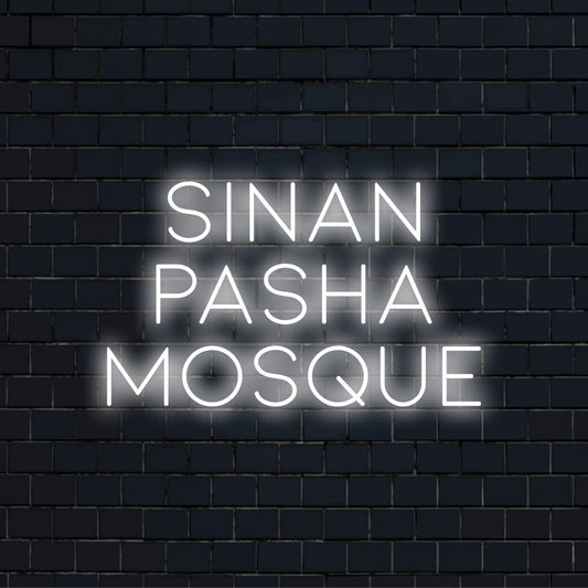Sinan Pasha Mosque Neon Light with bright neon lettering on black brick background