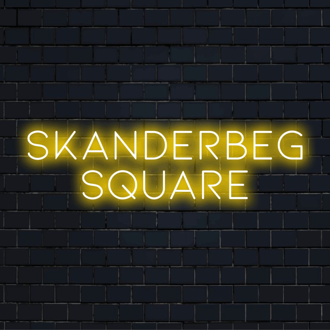 Skanderbeg Square Neon Light with neon text light on dark brick background