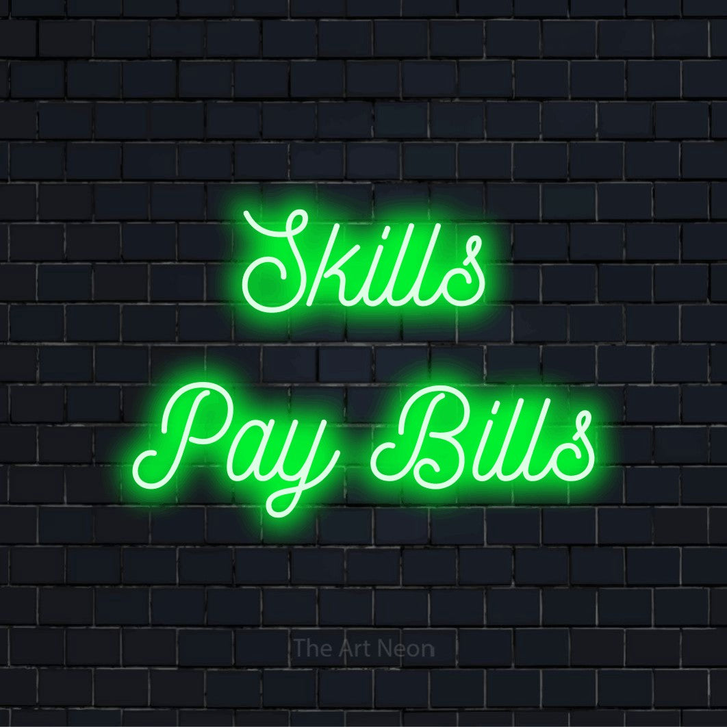 "Skills Pay Bills" neon text design on a black brick wall