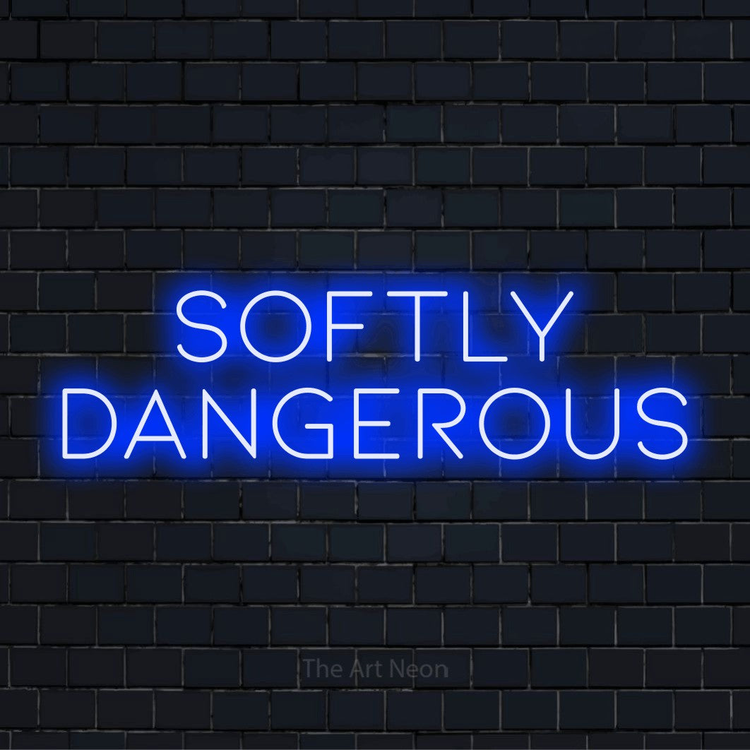 "Softly Dangerous" text design with neon effect on a black brick wall