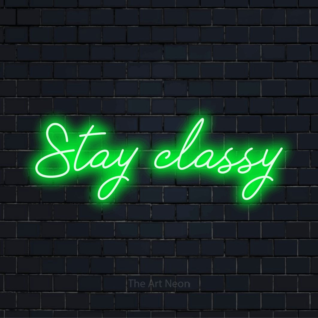 "Stay Classy" neon text design on a black brick wall