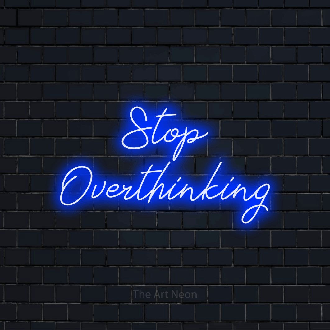 "Stop Overthinking" text design with neon effect on a black brick wall