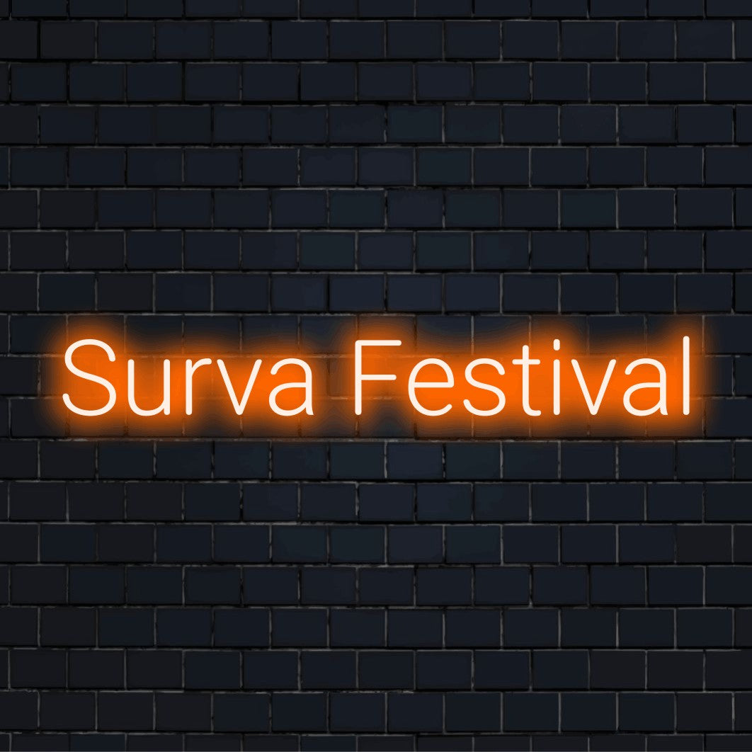 Surva Festival Neon Sign, glowing neon text on dark brick wall