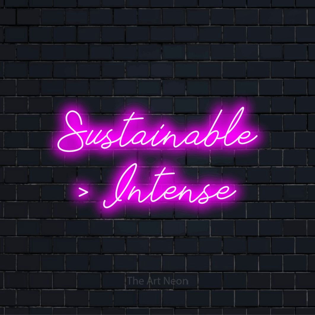 "Sustainable > Intense" neon text design on a black brick wall