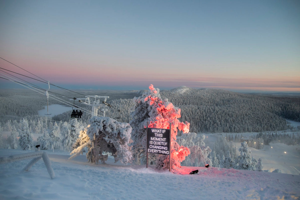 Outdoor LED neon text installation at Ruka Polar Night Light Festival in Finland