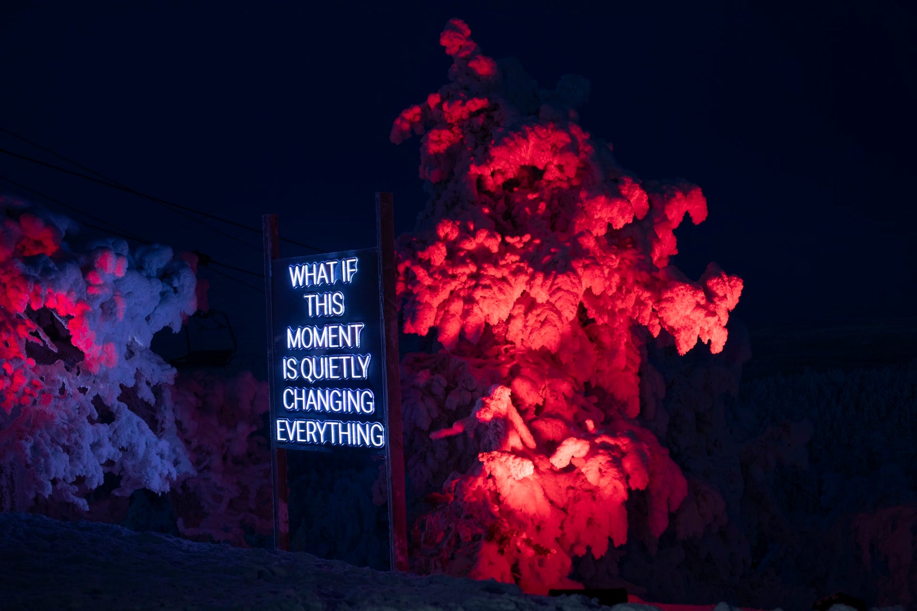 Outdoor LED neon text installation at Ruka Polar Night Light Festival in Finland