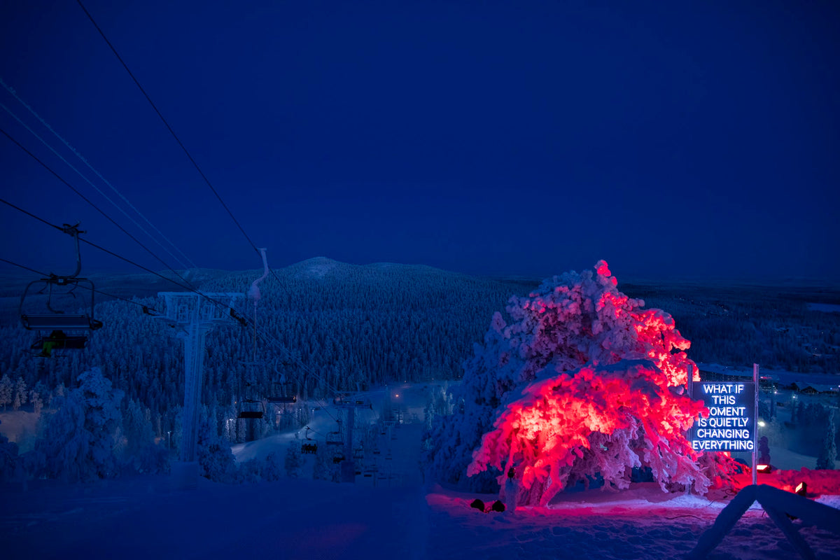 Outdoor LED neon text installation at Ruka Polar Night Light Festival in Finland