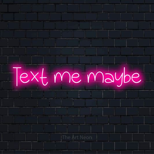 "Text Me Maybe" neon text design on a black brick wall