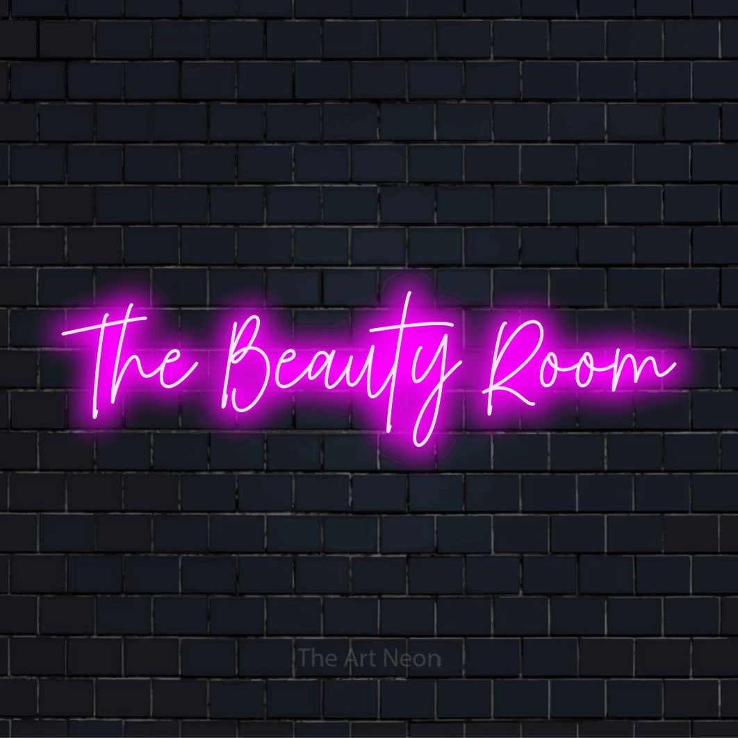 "The Beauty Room" glowing LED neon sign on a black brick wall