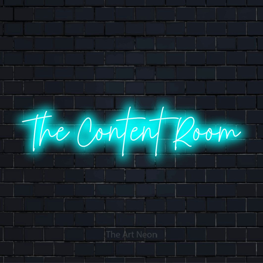 "The Content Room" script-style LED neon sign on a black brick wall
