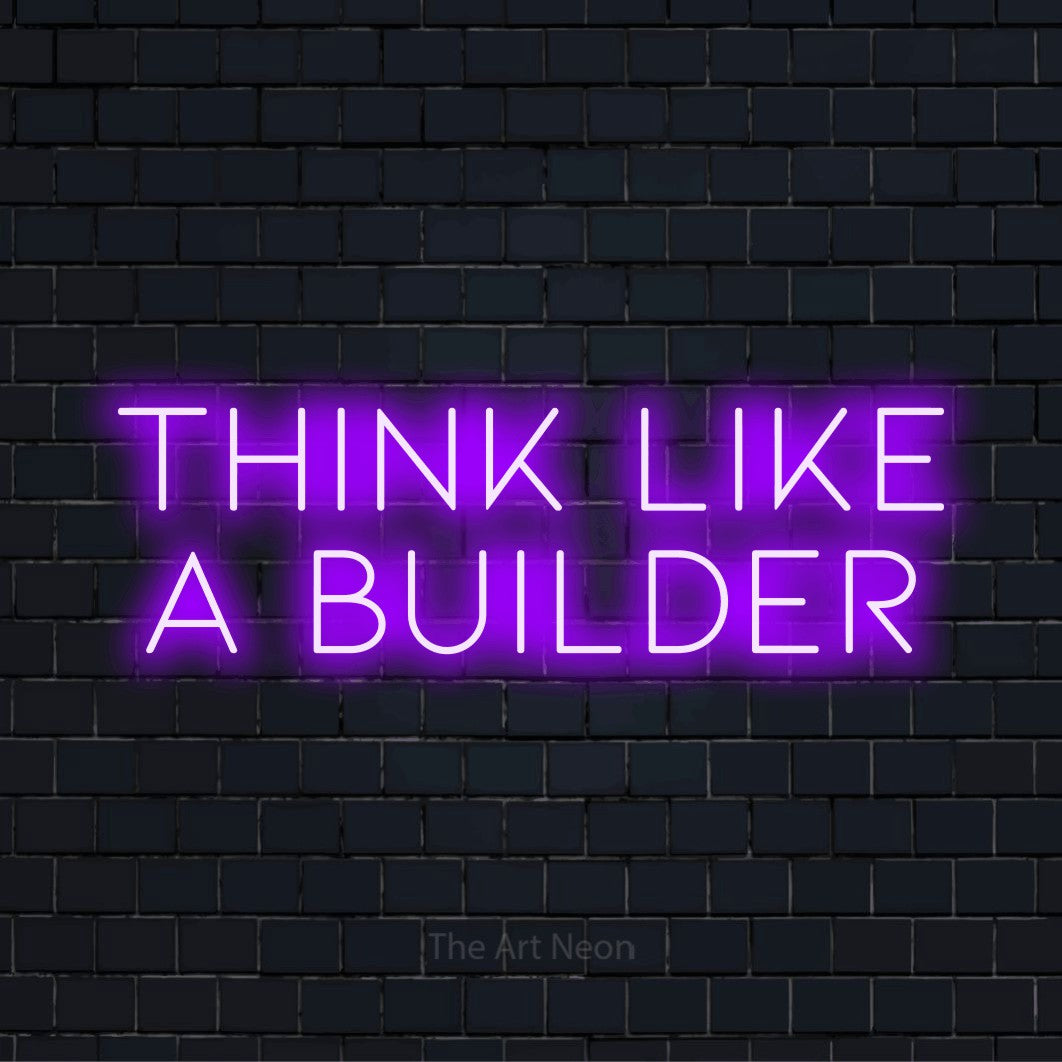"Think Like A Builder" glowing LED neon sign on a black brick wall