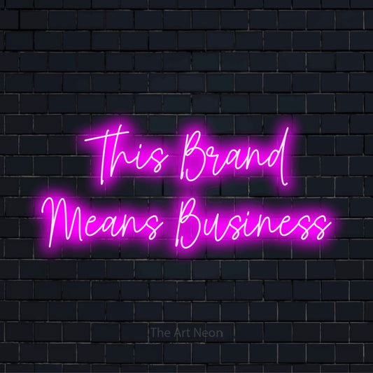 "This Brand Means Business" LED neon sign on a black brick wall