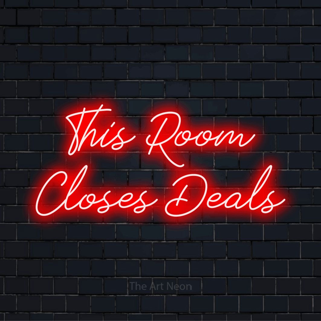"This Room Closes Deals" LED neon sign on a black brick wall