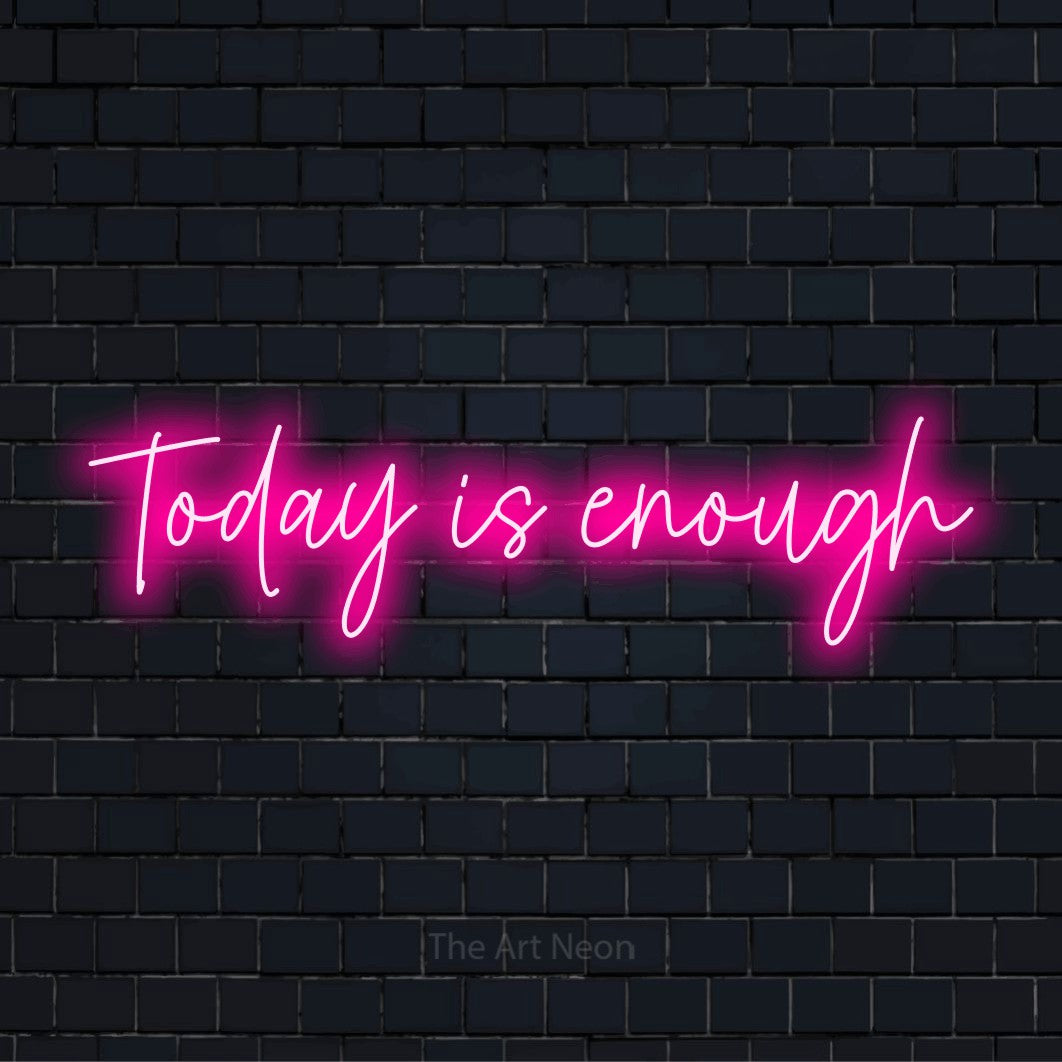 "Today Is Enough" neon text design on a black brick wall