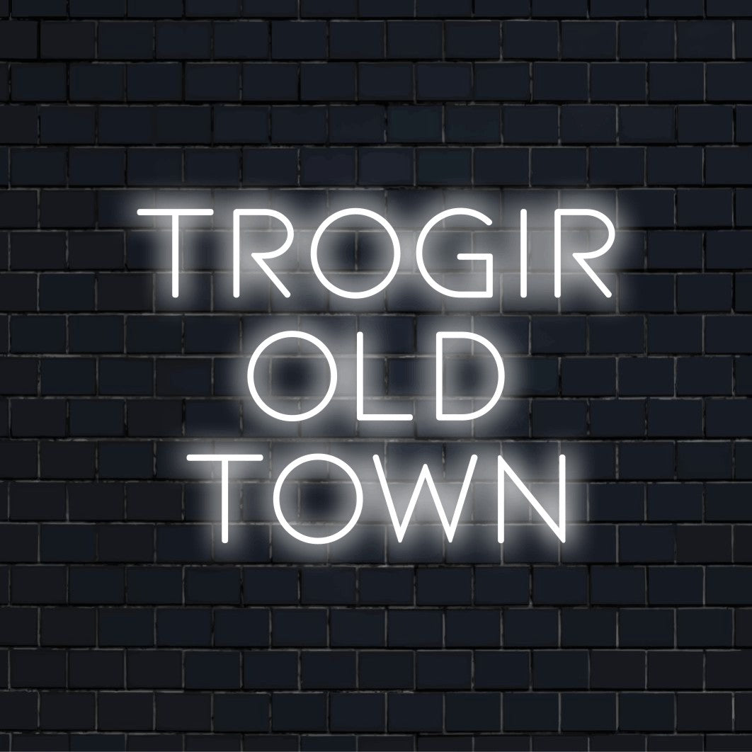 Trogir Old Town Neon Sign, glowing lettering against brick backdrop