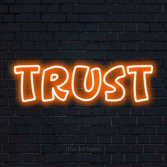 "Trust" neon text design on a black brick wall
