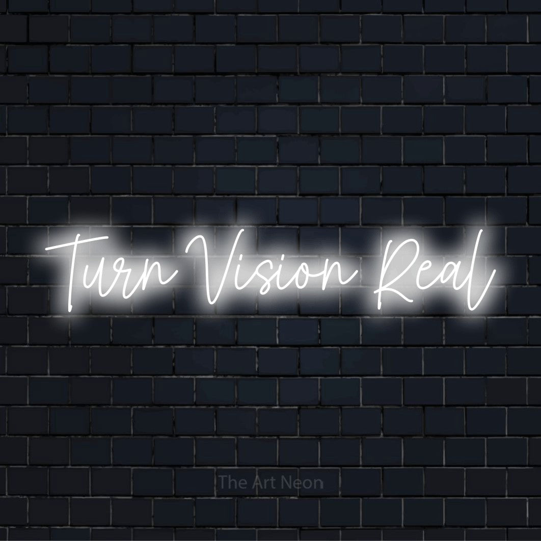 "Turn Vision Real" text design with neon effect on a black brick wall