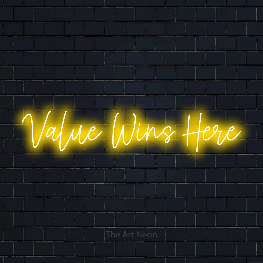 "Value Wins Here" script-style LED neon sign on a black brick wall