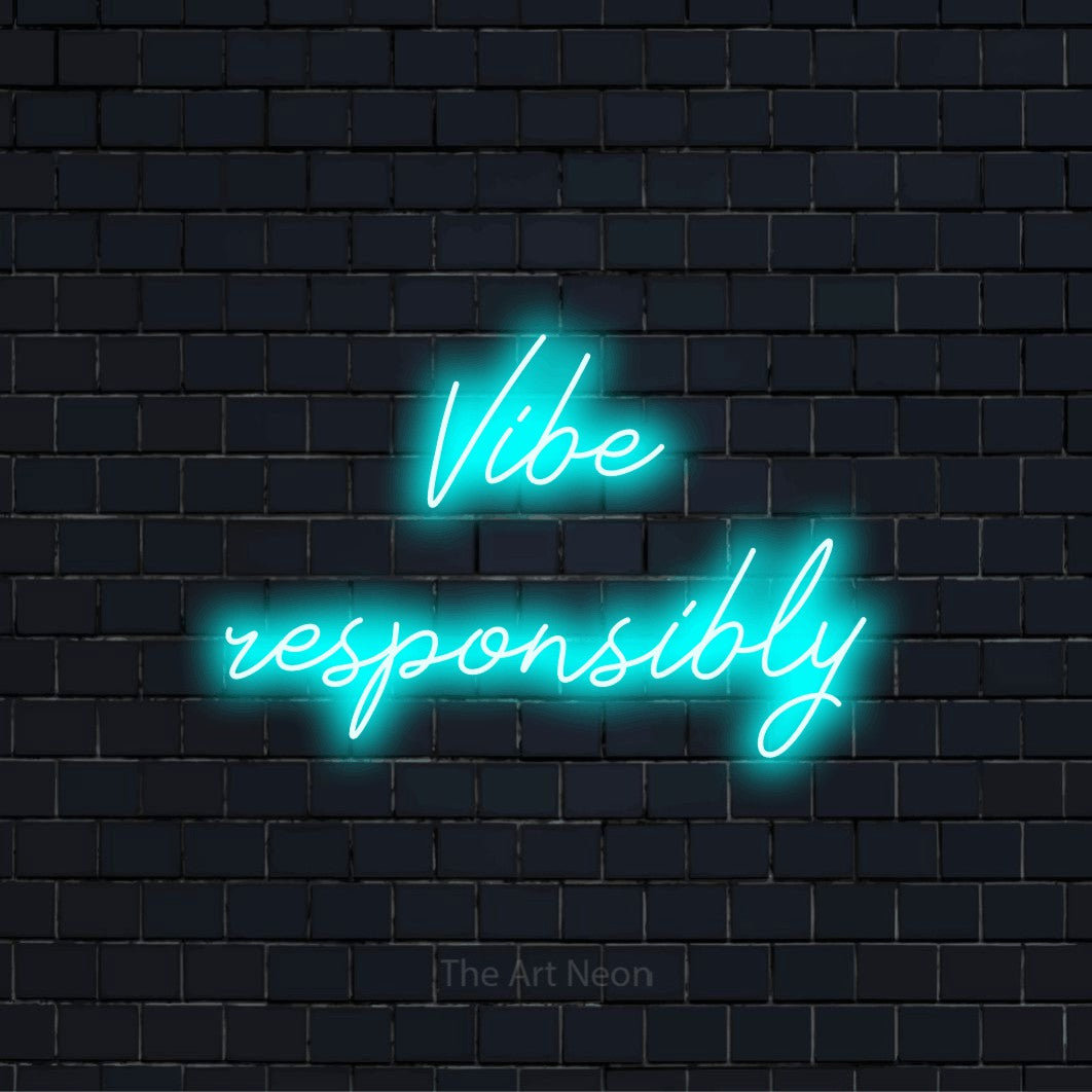 "Vibe Responsibly" script-style LED neon sign on a black brick wall