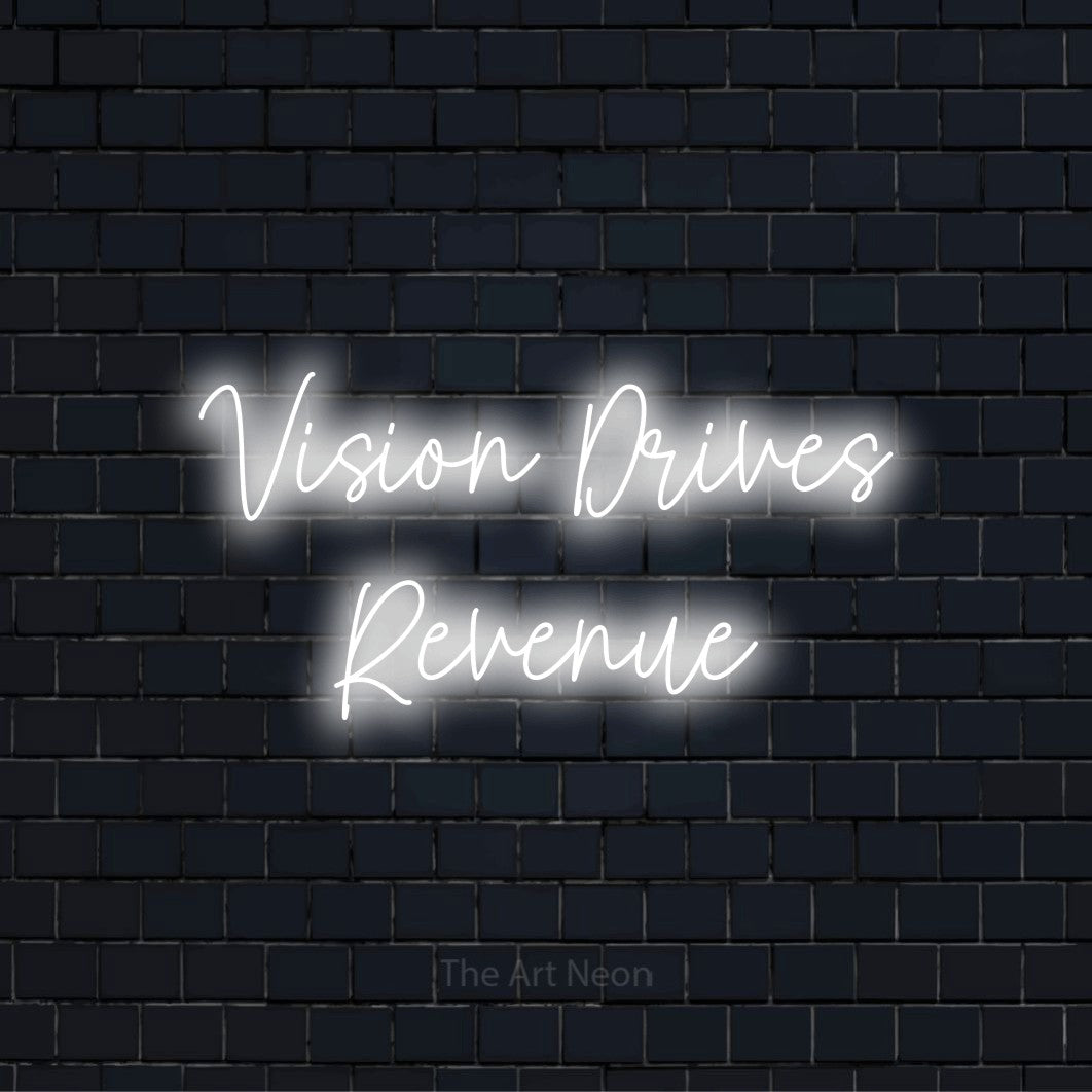 "Vision Drives Revenue" text design with neon effect on a black brick wall