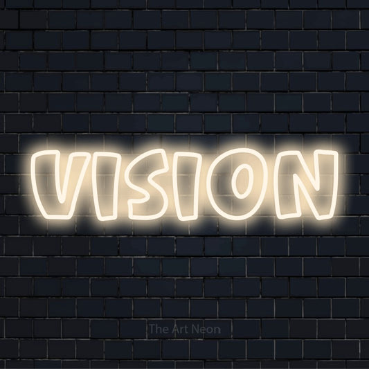 "Vision" script-style LED neon sign on a black brick wall