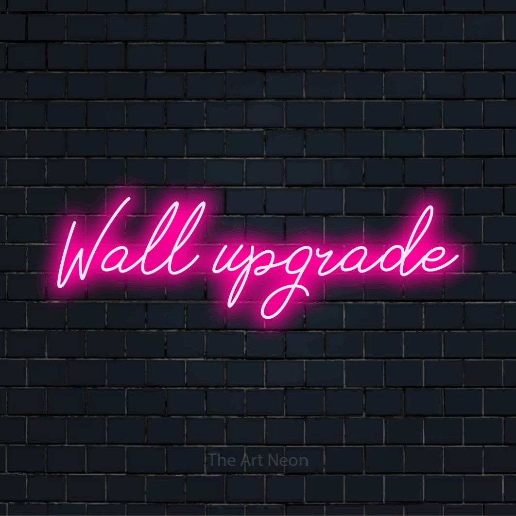 "Wall Upgrade" glowing LED neon sign on a black brick wall