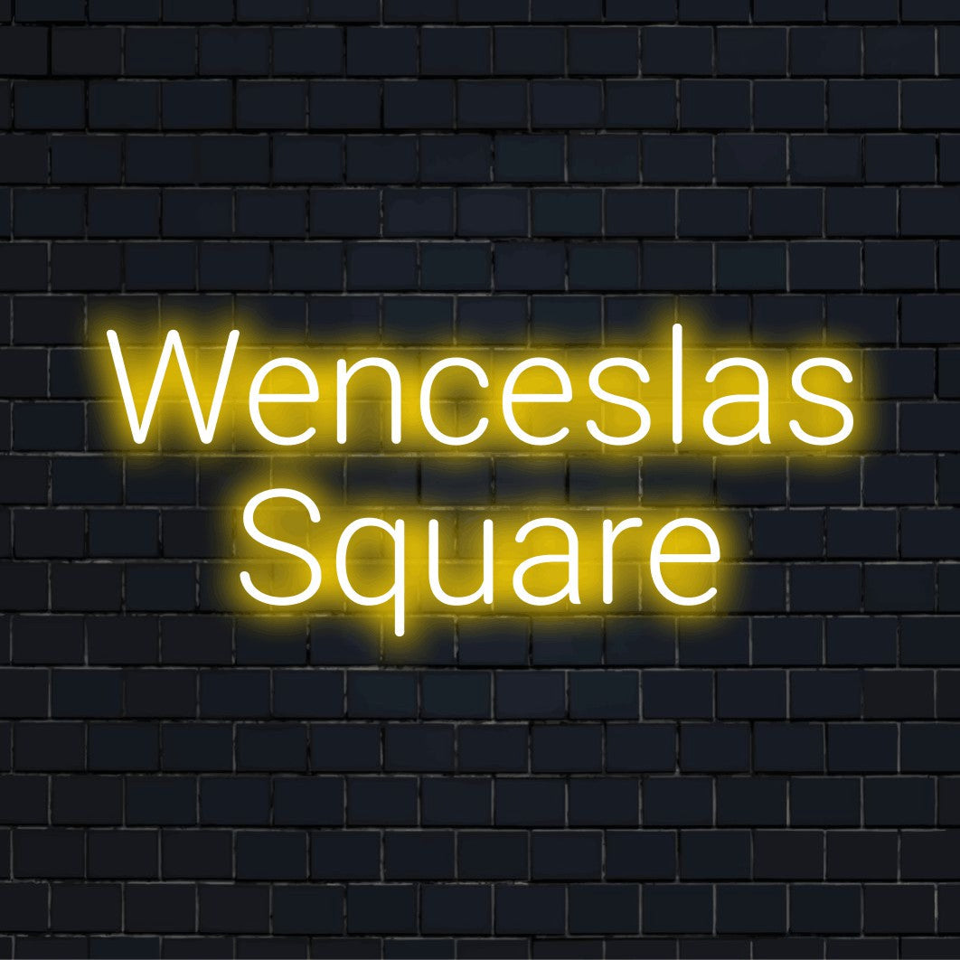 Wenceslas Square Neon Sign, glowing lettering against brick backdrop