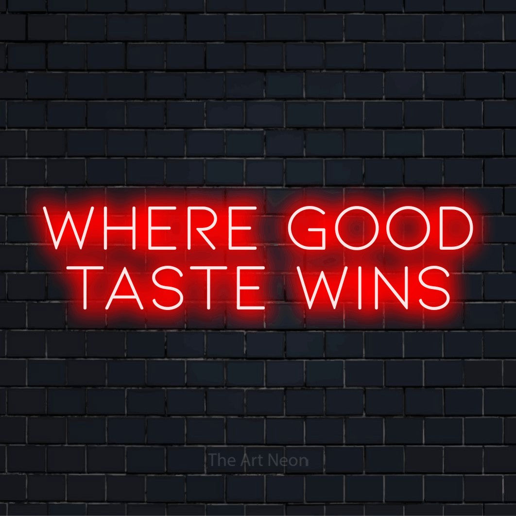 "Where Good Taste Wins" LED neon sign on a black brick wall