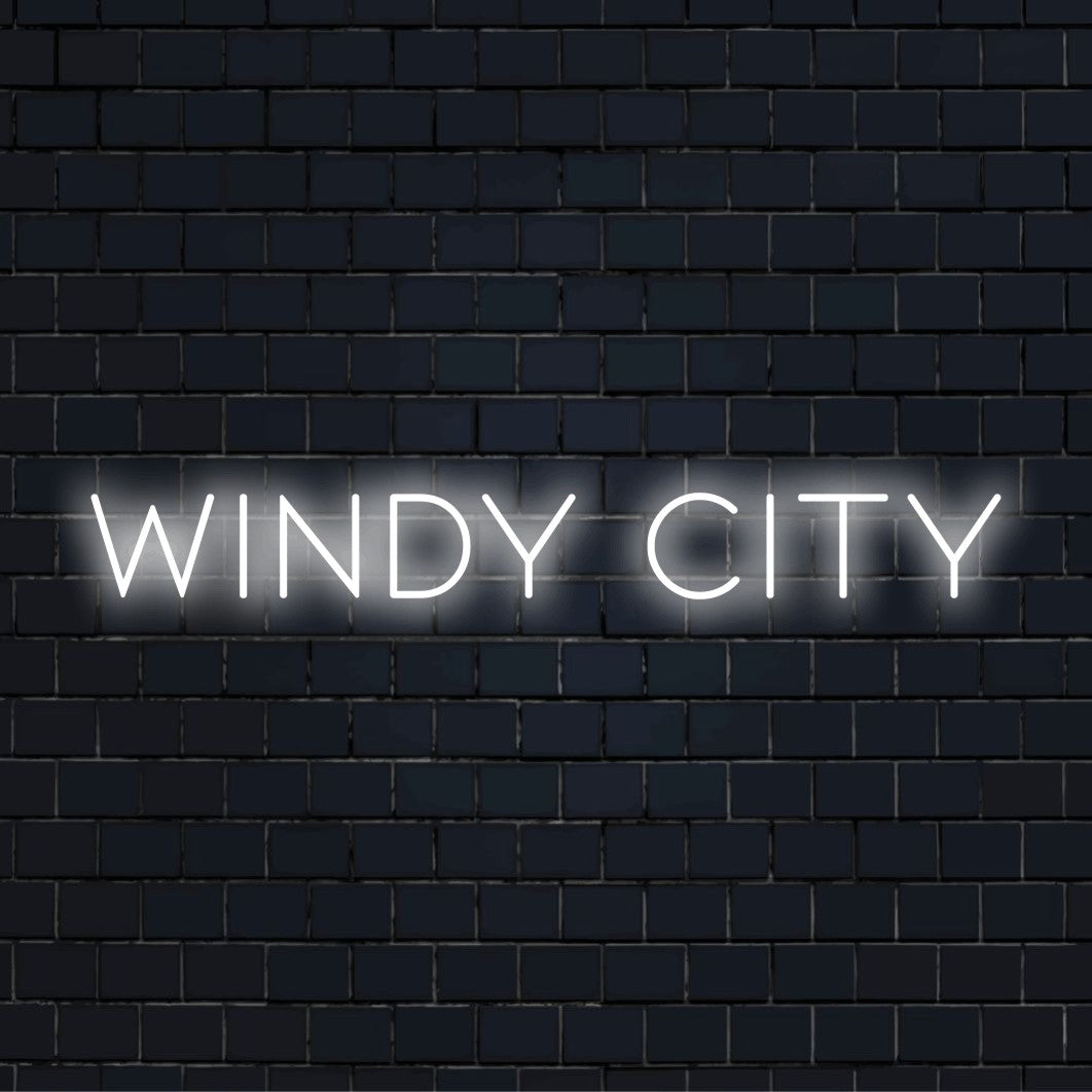 Windy City Neon Sign, neon text light on black brick background